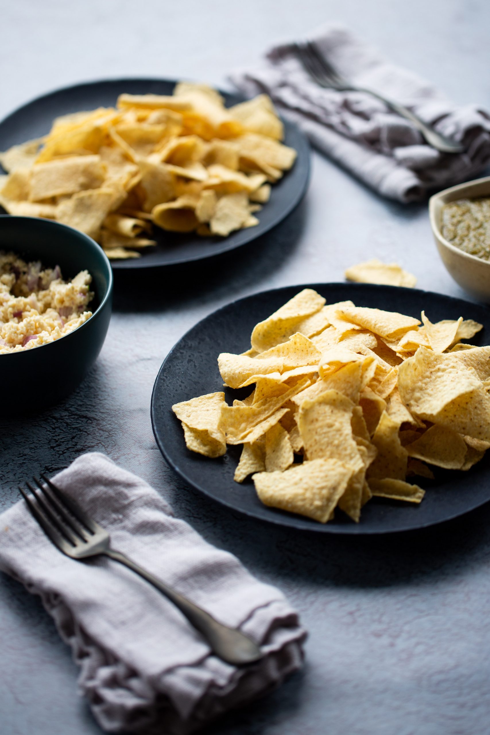 black plate with tortilla chips