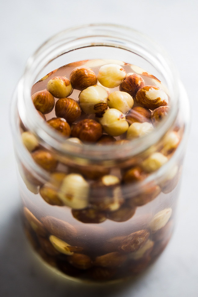 jar with hazelnuts and water
