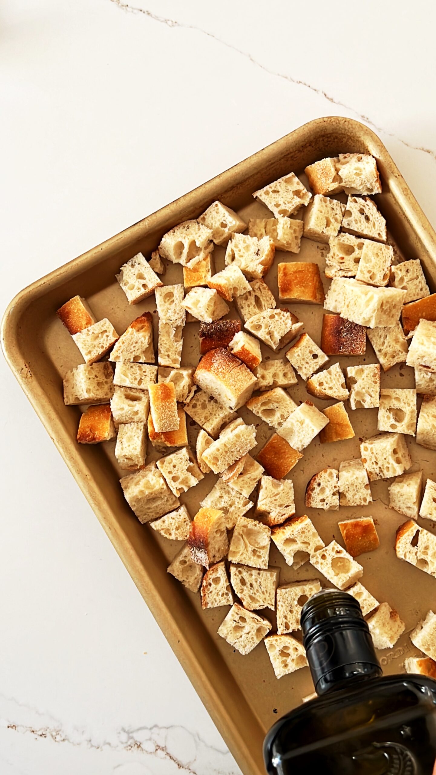 Baking sheet with cubed bread