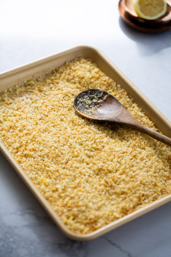 Toasted panko with olive oil on a baking sheet.