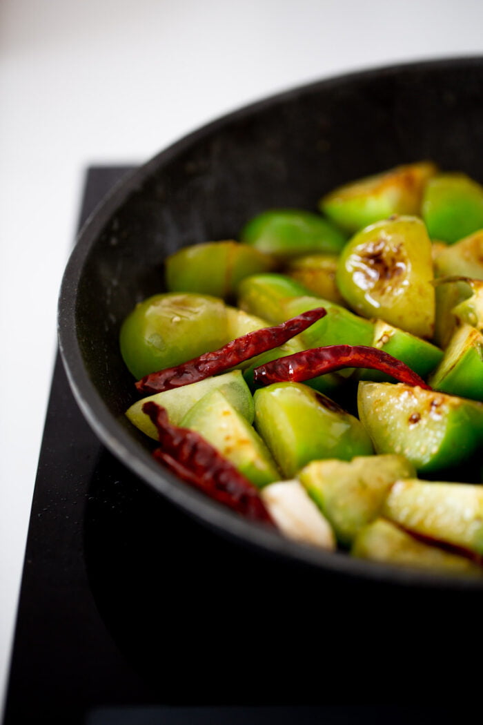 roasted tomatillos in a skillet