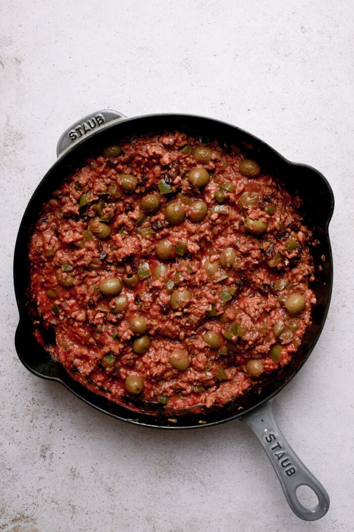 Cuban picadillo in a cast iron pan.