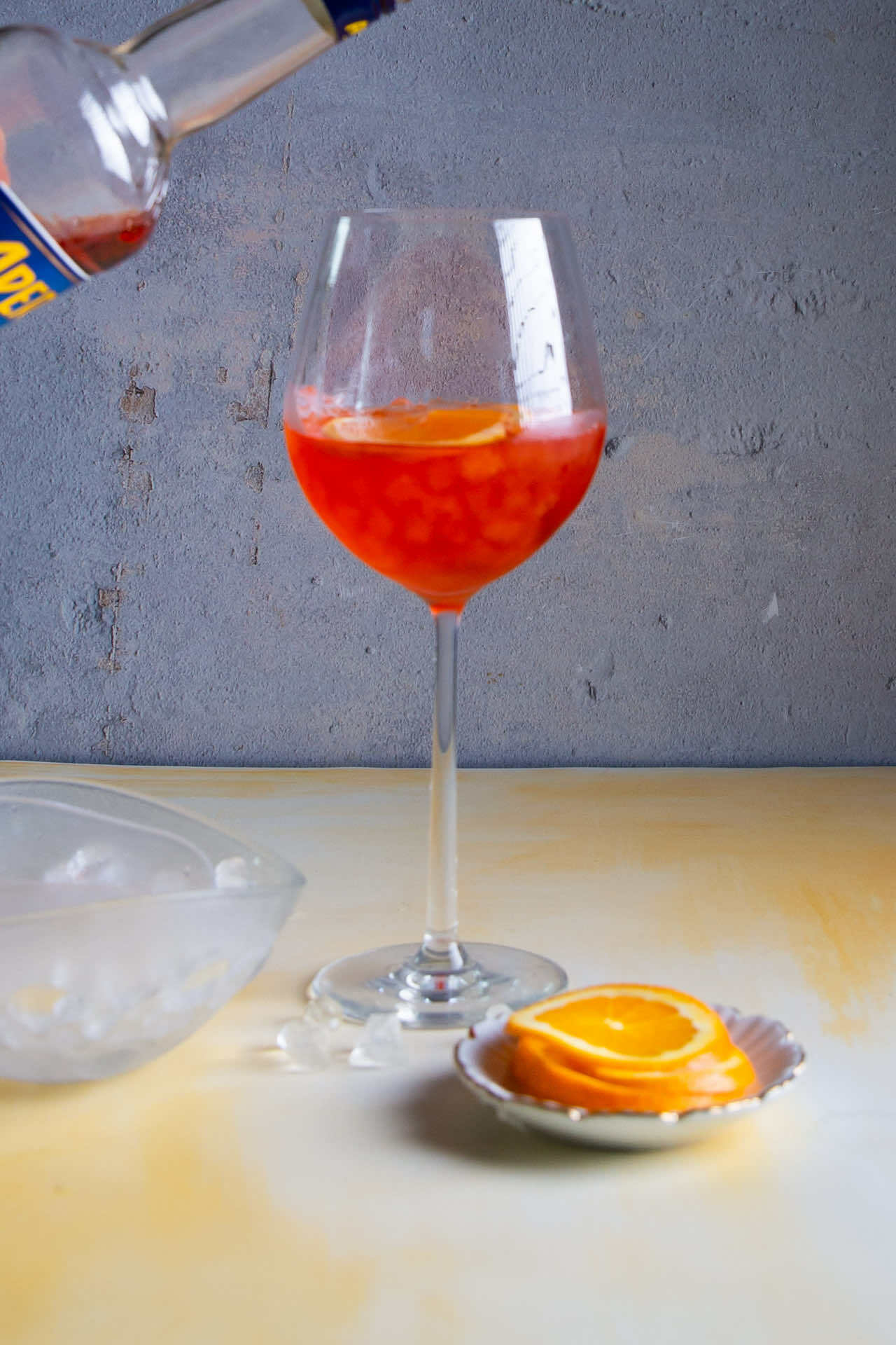 serving aperol to a glass