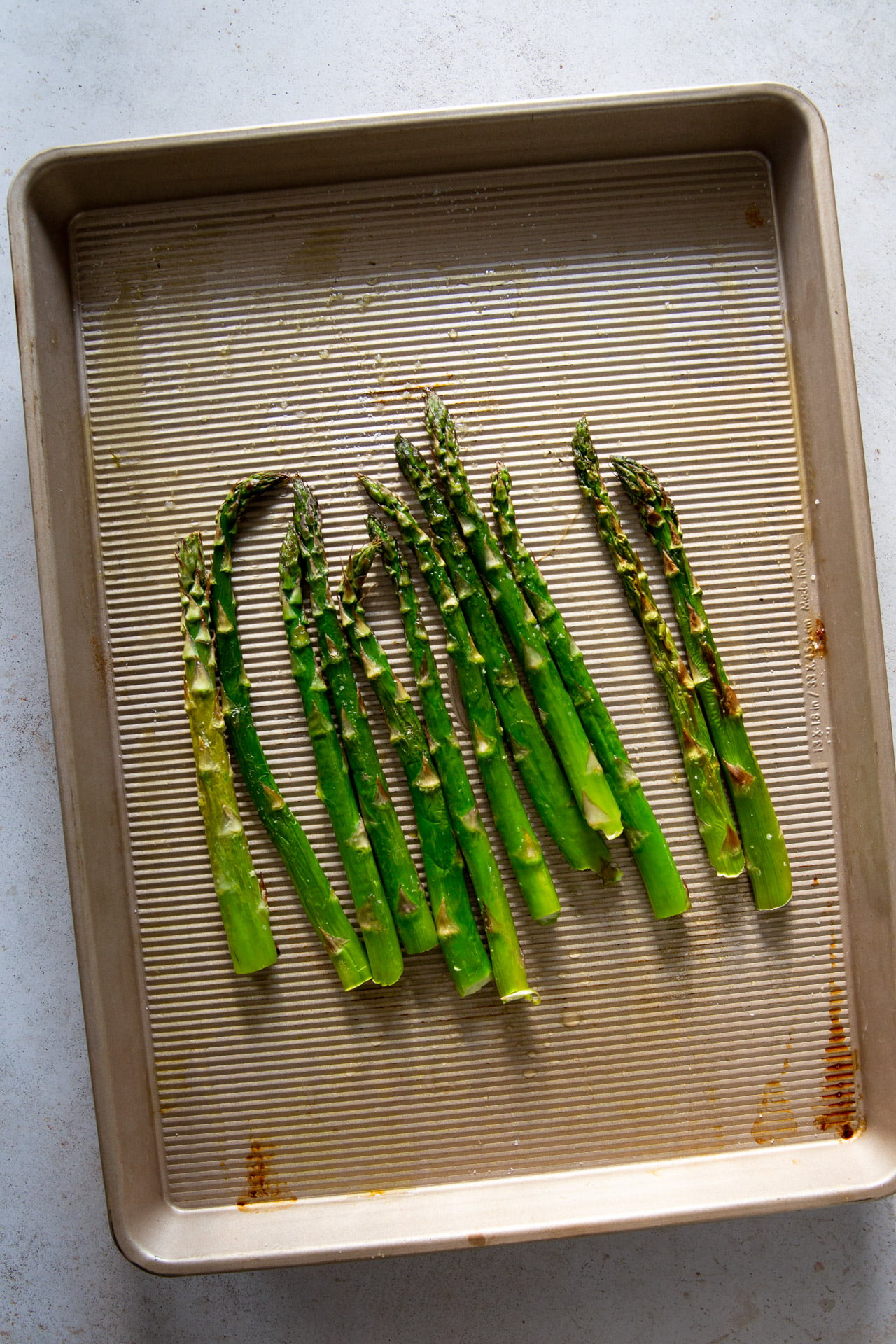 asparagus cooked on top of an air tray.