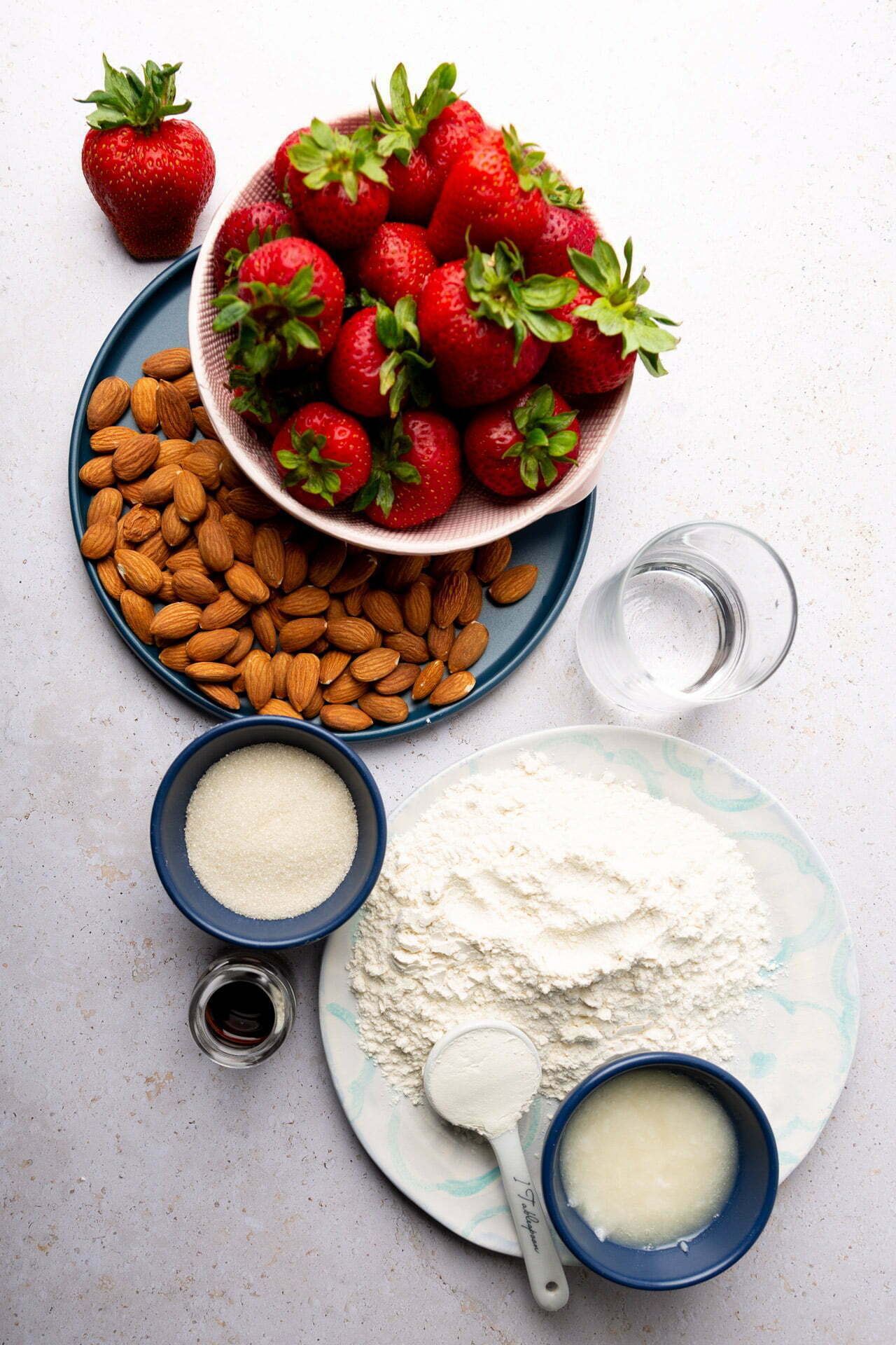 ingredients for Almond Crust Strawberry Galette  placed on small plates