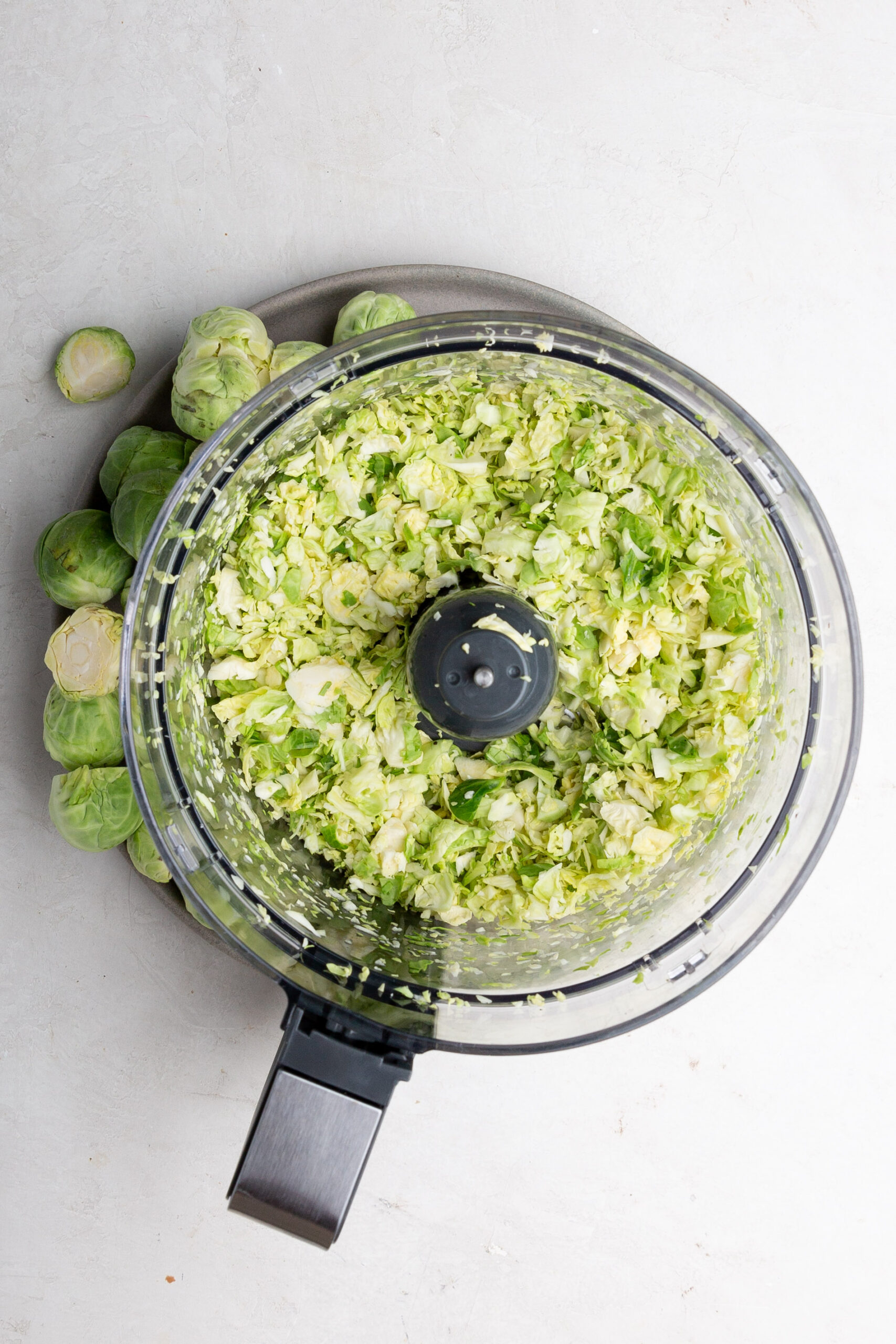 Description: Brussels sprouts in a food processor.