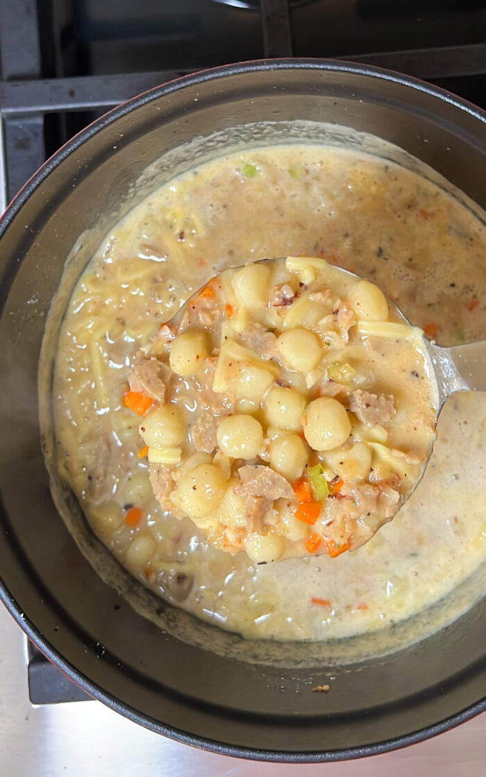A deliciously creamy vegan sausage soup with vegetables.