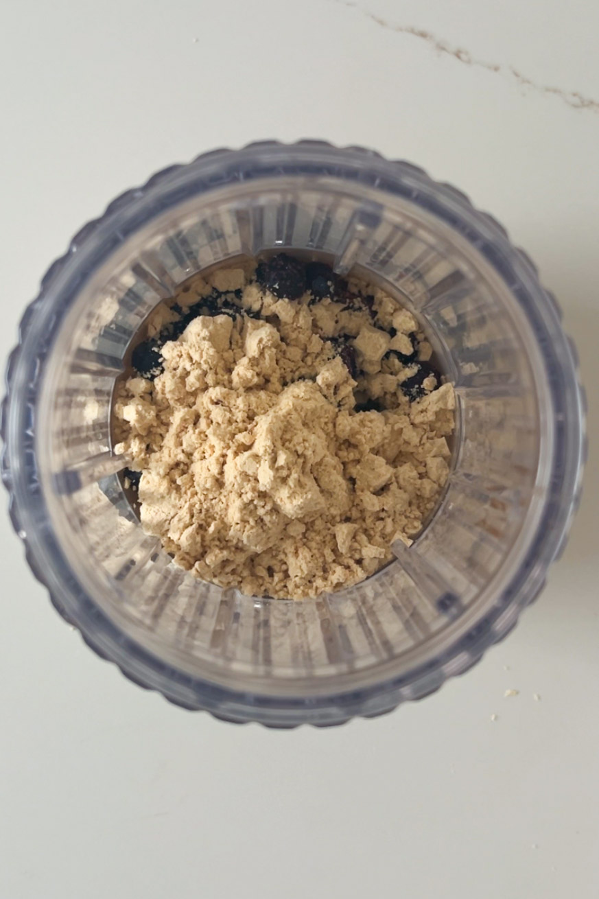 A protein shake blender filled with a mixture of flour and oatmeal.